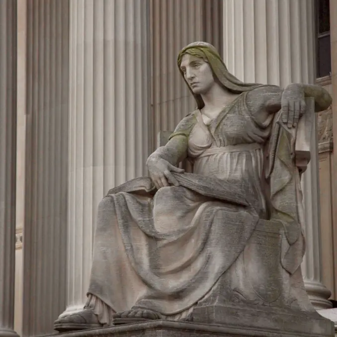 The 'Authority of Law' statue at the entrance of the U.S. Supreme Court, illustrating the institutional governance and high-level oversight required for regulatory strategy.